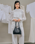 Norri top handle bag in Black for women