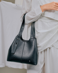 Women's shoulder bag with detachable pouch in Black