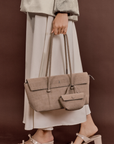 Model styling Rico Rinaldi Mendy Latte shoulder bag, premium women's work handbag with detachable mini pouch and secure zip closure
