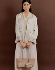 Model carrying Rico Rinaldi Mendy Latte East-West shoulder bag, premium crocodile embossed PU vegan leather women's work handbag with detachable mini pouch